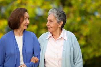 Two older women go for a walk together