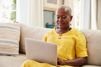 Woman taking cognitive assessment on her laptop computer.