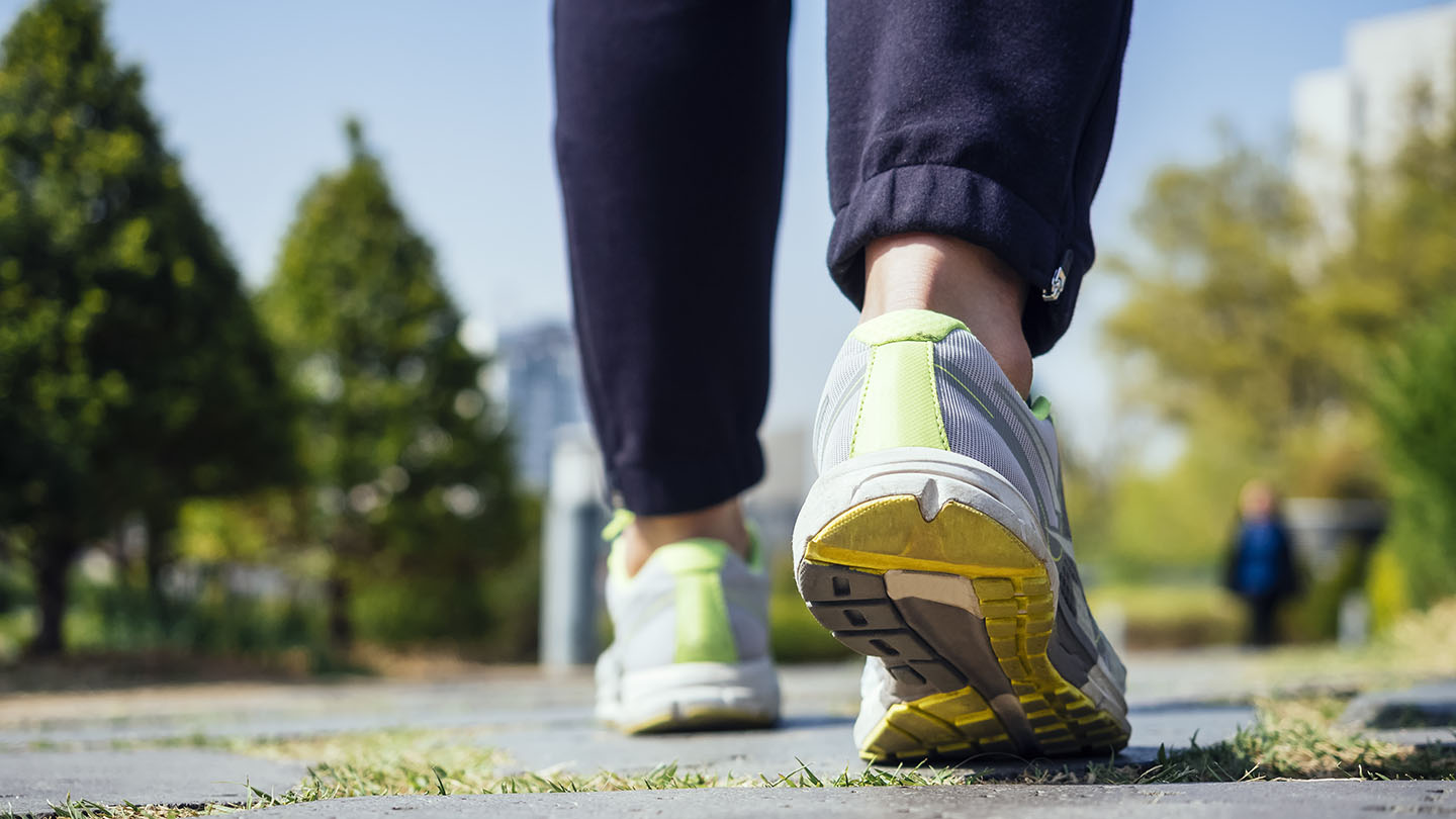 Feet in sneakers taking a step